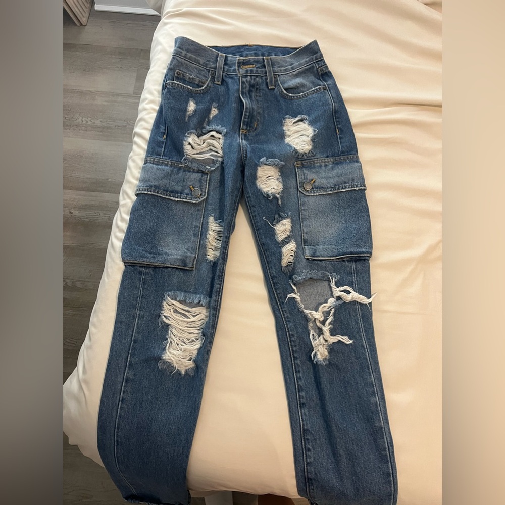 dark blue washed ripped carmar jeans with pockets on the sides. size 24
